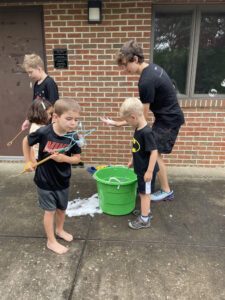 vbs children play with bubbles